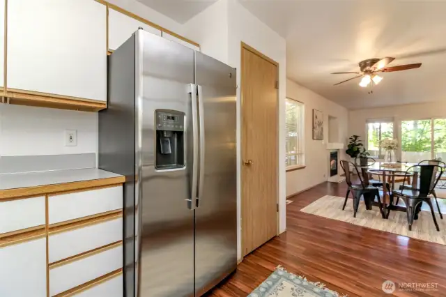 Pantry to the right of the fridge.