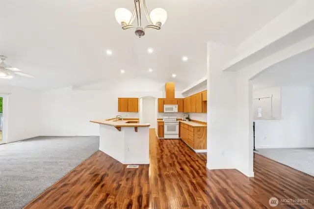 This view of the Home shows off the fantastic floor plan, with excellent flow in and out of the different living spaces. The Living Room and Front Entry are off to the right, with the large Family Room to the left.