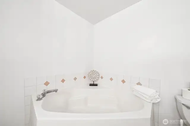 Enjoy this oversized, corner soaking tub in the Primary Bath.