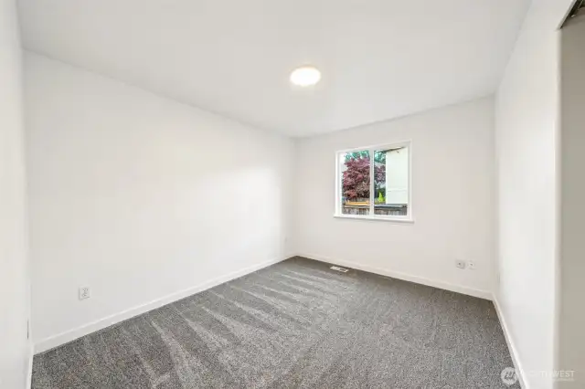 Bedroom #2 is spacious and overlooks the side of the home.