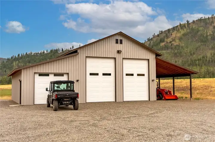 Expansive multi-bay shop offers exceptional versatility with oversized garage doors, high ceilings, and an attached covered area ideal for equipment, RV, or boat storage. Ample space for vehicles, tools, and recreational gear makes this a dream setup for hobbyists, collectors, or anyone seeking serious storage and workspace.