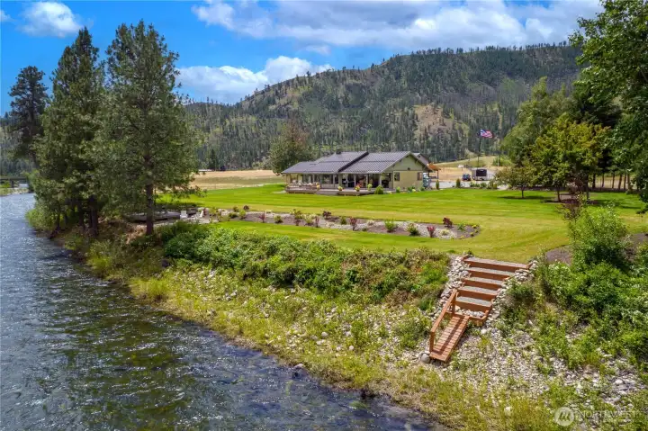 Beautifully positioned along the river, this home features a spacious wraparound deck and landscaped grounds. A private stairway leads directly to the water, creating effortless access for fishing, kayaking, or simply enjoying the serene waterfront lifestyle.