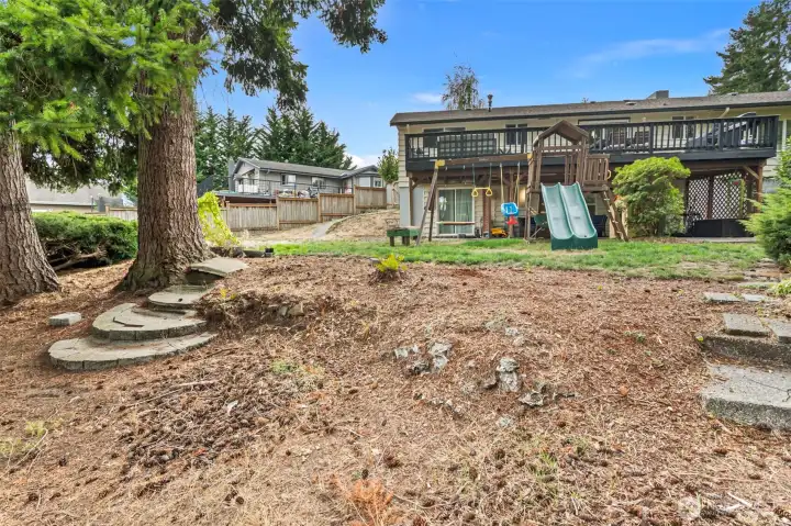 Fully fenced yard with gates on either side