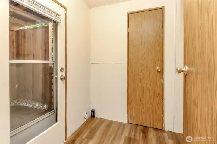 W/D hook ups in this room off the kitchen. This back door leads to the covered deck