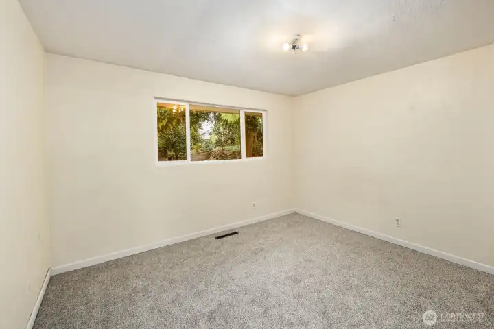 Bedroom on the right side of hallway.