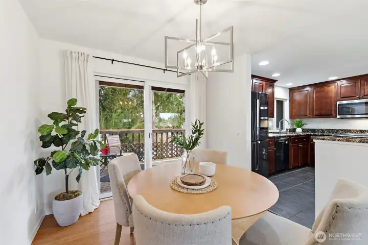 Sliding doors open to the deck, merging indoor and outdoor living.