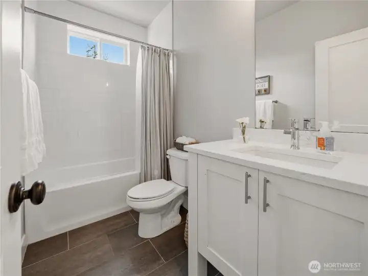 Main floor full bathroom situated directly across from the second main floor bedroom which makes it perfect for guests or the convenience of 2 bedrooms on the main level.