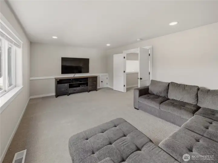 Upstairs room with closet can be used as a bedroom or bonus room.