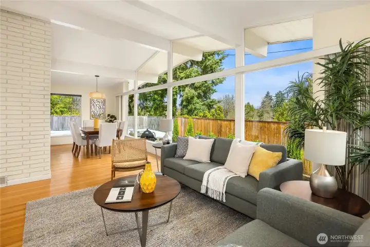 Vaulted ceilings and expansive windows bring in natural light and garden views.