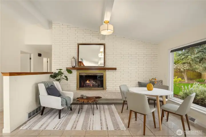 Relax around the fireside in the open family room and dining nook just off the kitchen.