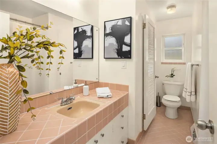 Full guest bath with separate commode/shower room.