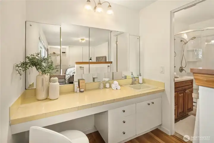 Vanity area looking toward the private 3/4 bath with shower.
