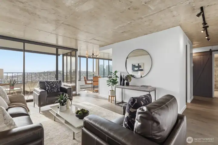 Hardwood floors and polished concrete ceilings shine in fantastic westerly light pouring in through walls of windows.