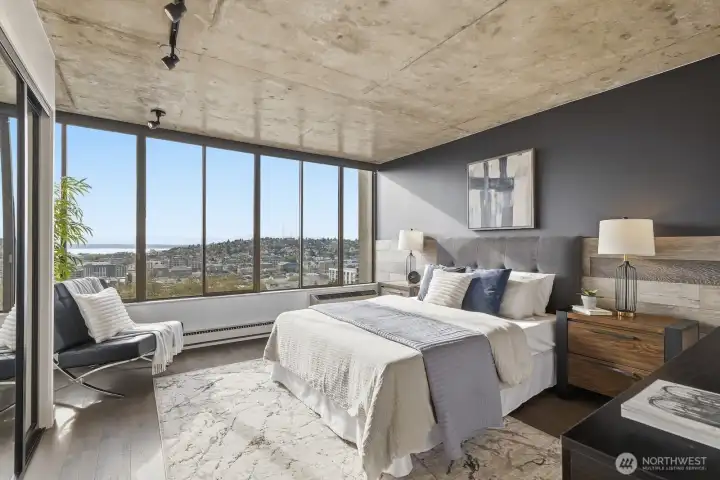 The primary bedroom is bright and spacious, yet cozy and comfortable - perfectly conducive to rest and relaxation.