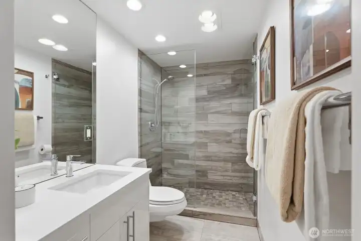 Stylishly updated 3/4 bath, great for guests.