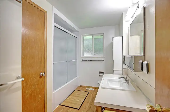 Full bath with large storage.