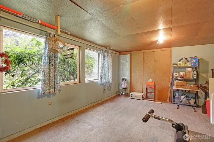 This is the other half of the large downstairs room.  Windows face east. It's a basic room, seller will have  door locked for a time.  Ask agent for access if need be.