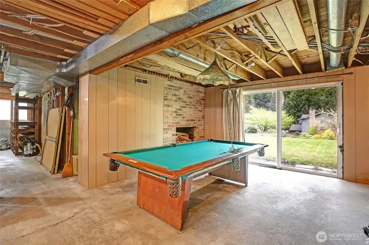 Yahoo! Downstairs basement fun time for friends and entertainment.  Wood brick  fireplace, slider faces east.Plenty of places to store things here.