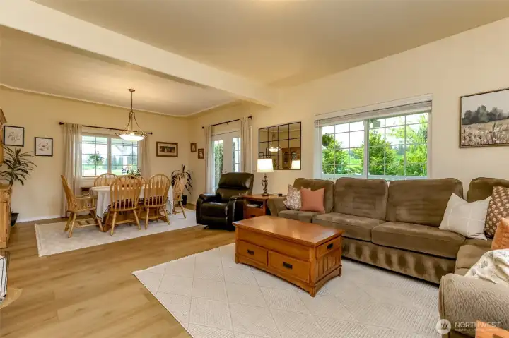 Living Room open to dDning Room French Doors to Covered Porch