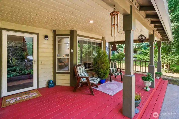 A covered front porch like this deserves a rocking chair and zero responsibilities.