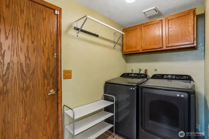 Not glamorous… but honestly one of the most practical features in the house. Main floor laundry right off the garage just makes sense.