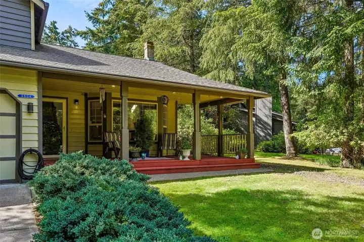 A covered porch, mature trees, and peaceful surroundings? Say less.