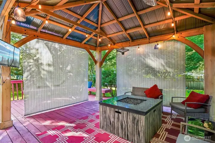 Private, covered, and designed for year-round enjoyment… this outdoor space is such a standout feature of the home.