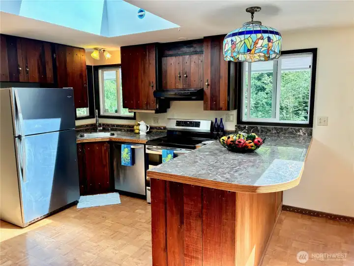 This kitchen is flooded with natural light ..