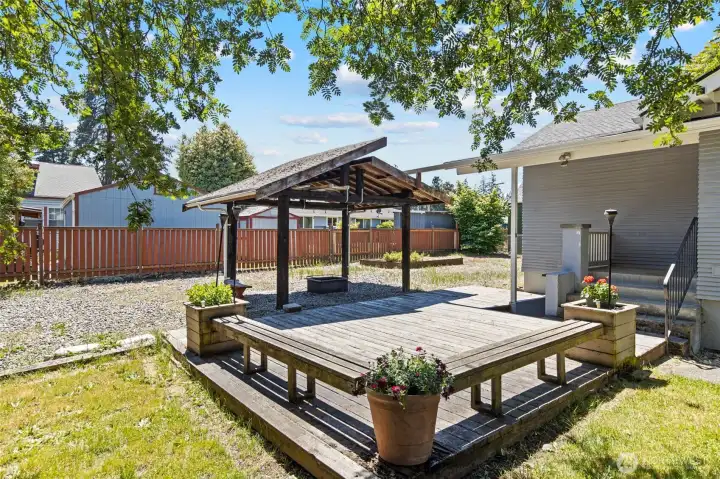 Gazebo, firepit area, and great deck space.  The first set of stairs lead to the back door of the kitchen in the main living area - there is a second staircase to the left of the pony wall that leads to the lower living space.