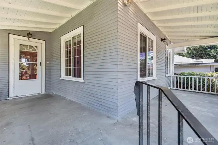 Large covered front porch exudes warmth and hospitality