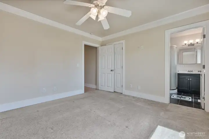 Primary bedroom has its own three-quarter bath and walk-in closet
