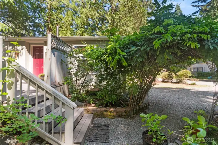 A charming arbor and beautifully landscaped walkway create a warm, inviting entrance to your new home. A charming arbor and beautifully landscaped walkway create a warm, inviting entrance to your new home.