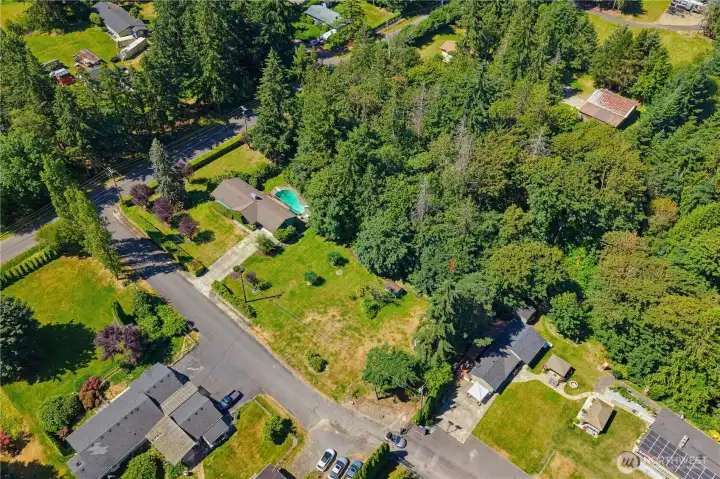 Spacious 2 acres with one large flat acre and a steeper extra 2 parcels behind for total privacy!