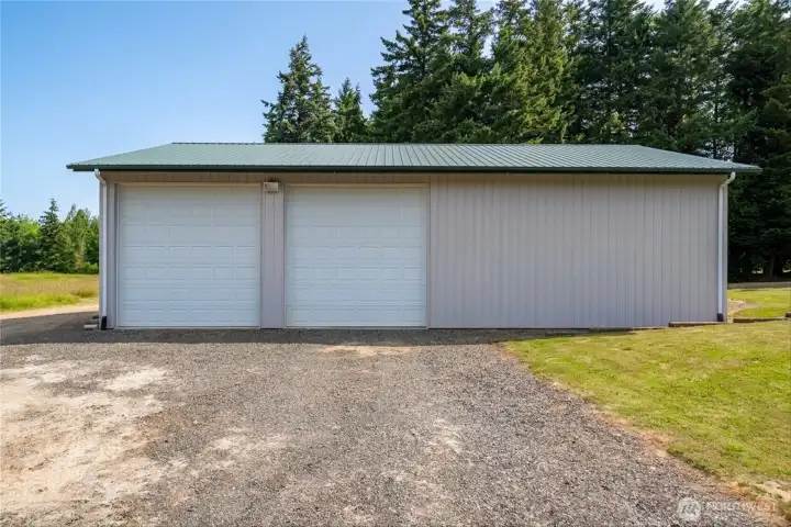 This huge 3-bay shop has room for all your things! Here we see the front side, with 2 doors -- the 3rd door is on the back side, connected to a 2nd driveway! This huge 3-bay shop has room for all your things! Here we see the front side, with 2 doors -- the 3rd door is on the back side, connected to a 2nd driveway!
