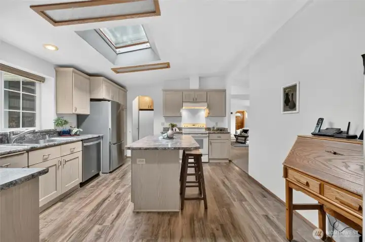 The kitchen features an island with an eat-in bar! The kitchen features an island with an eat-in bar!
