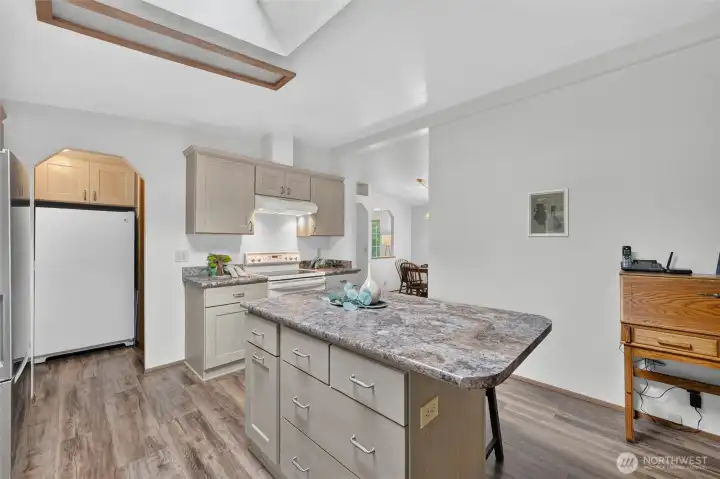 The kitchen features an island with an eat-in bar! The kitchen features an island with an eat-in bar!