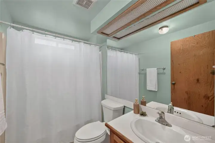 Full bathroom, located off the family room, between 2 bedrooms. Full bathroom, located off the family room, between 2 bedrooms.