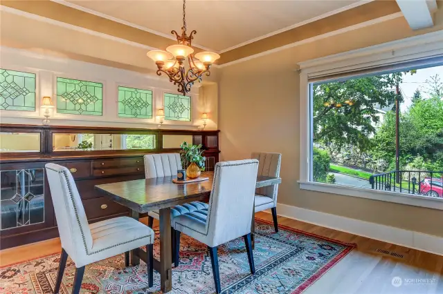 Beautiful built in hutch and perserved antique windows provide character along side large picture window allowing for an abundance of natural light.