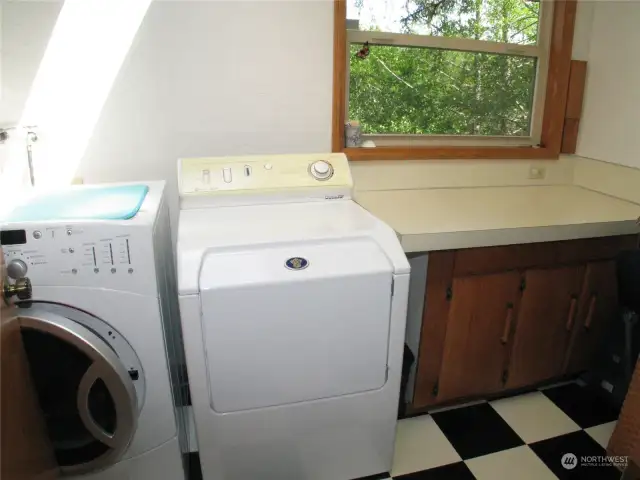 Large laundry room with washer and dryer.