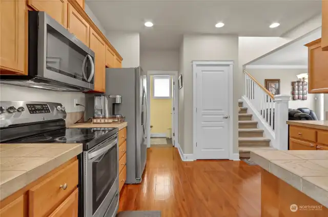 Kitchen,Kitchen looking toward Powder Room, and entry to garage to the left of the powder room