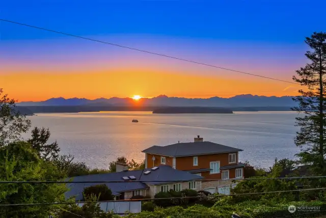 Imagine coming home every day to  breathtaking 180-degree panoramic views of  Puget Sound, the Olympic Mountains, and  Vashon and Blake Islands. This stunning 2004  Omni-built home is designed to embrace  these vistas, offering the perfect balance of  luxury, comfort, and functionality.