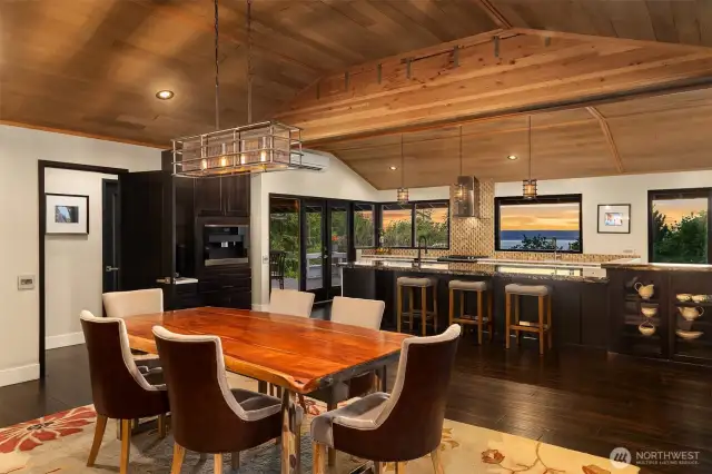 View from the dining area towards the sizable kitchen and covered patio.