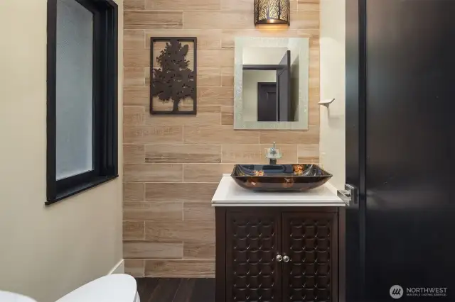 Half bath by the main living area and the side entrance coming from the carport.
