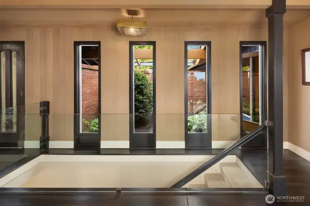 Architectural details overlooking the courtyard/interior garden. The owners replaced the wood post railing by a glass one to let the light in.