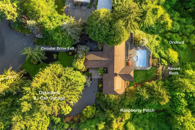 Aerial view pinpointing orchard, garage and circular drive.