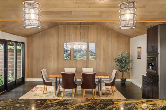 View from the kitchen island towards the dining room and built-in coffee station.