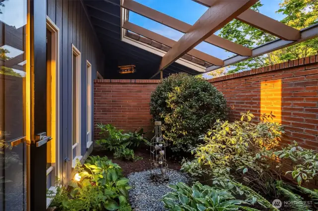 Delightful detail from the dining room & hallway: an interior courtyard/garden.