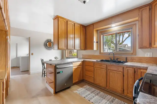 Built-ins storage has an desk nook for a mini home office space or coffee nook.