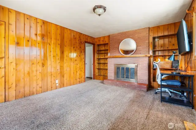 Brick fireplace and gorgeous woodwork in 3rd Bedroom