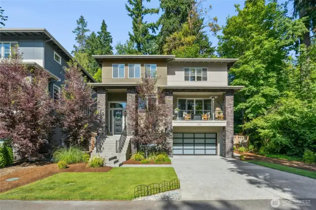 Modern sophistication meets timeless design in this stunning 5-bedroom, 4-bath Northwest contemporary nestled in the desirable Holmes Point / Denny Park community.